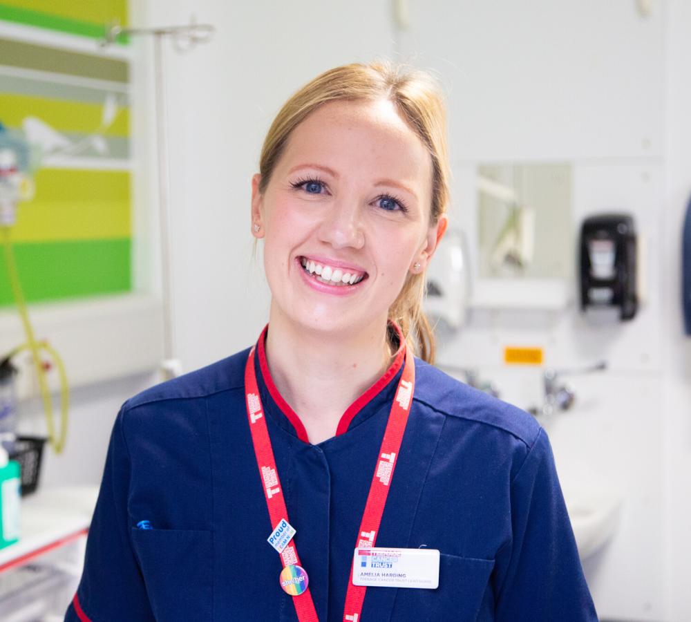 Amelia Harding, a Teenage Cancer Trust lead nurse, smiling at the camera