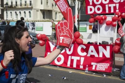 Teenage Cancer Trust Brighton Marathon cheer squad with big foam finger