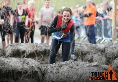 Young Lady in the electric section of tough mudder