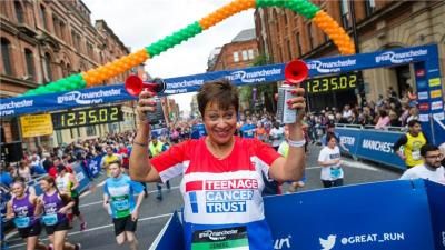 Denise Welch at Teenage Cancer Trust Great Mancher Run start line, with two air horns