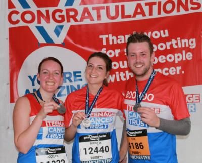 Teenage Cancer Trust Great Mancher Run race team with their medals post race