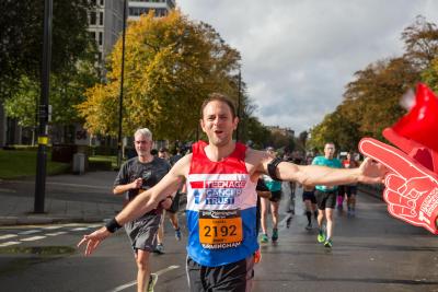 Teenage Cancer Trust Great Birmingham Run runner high fiving cheer squad foam fingers