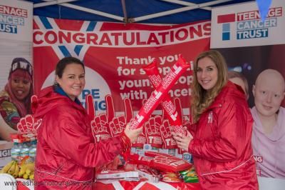Two people at Teenage Cancer Trust Great Birmingham Run welcome stand