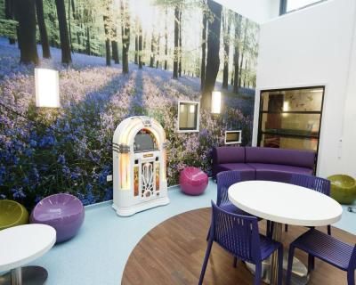 The social space with a jukebox in the atrium at Bristol Children's Hospital