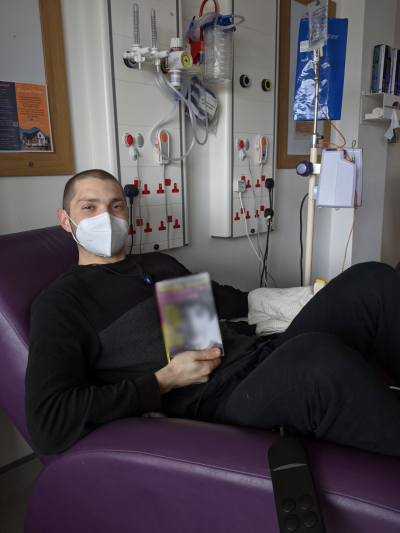 Gonzalo in hospital posing with a book