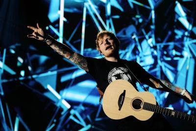 Ed Sheeran wearing a Teenage Cancer Trust at the Royal Albert Hall t-shirt which is being sold on our online merch store
