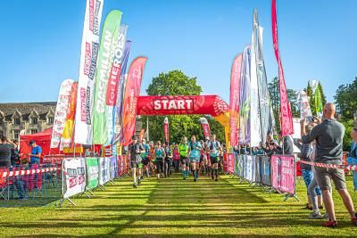 The start line of the Cotswold Way Challenge with a group of walkers setting off