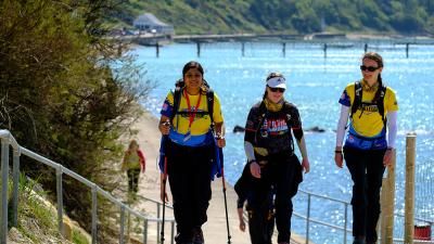 Walkers taking on the Isle of Wight challenge beside the sea