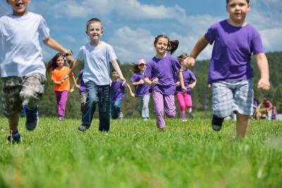 Children running in a field