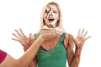 A woman who has had a pie in her face