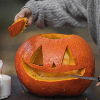 A pumpkin with a face carved into it