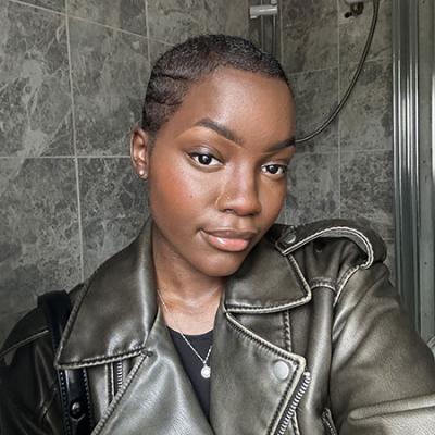Yami taking a selfie showing her hair growing back, after chemo