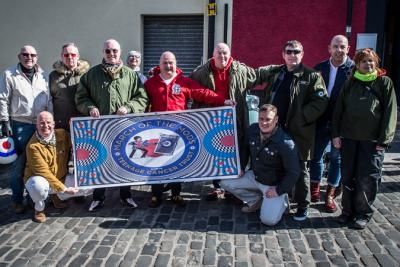 A group of people holding a banner reading 'March of the Mods'