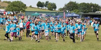 A group of runners wearing blue T-shirts taking part in the Royston in Blue 5K