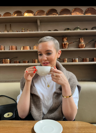 Izzy drinking a coffee