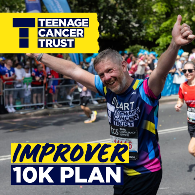 Male runner smiling at camera with thumbs up