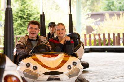 A young man and woman in a dodgem car